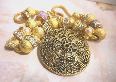 Beautiful one of a kind hand assembled necklace with gold tone beads & charms