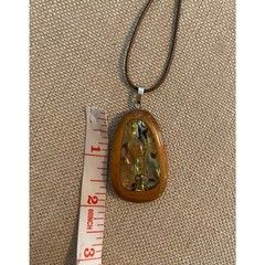 Abalone inlaid in polished wood pendant on cord