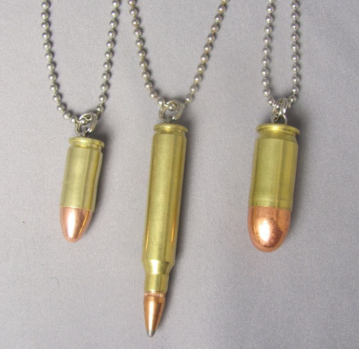 Three Bullet pendants or key rings 9mm, 223 cal and 45