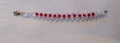 Made with Swarovski 6mm Bicone Beads AB Crystal & Lt Siam (Red) Fits7 1/2″ Wrist