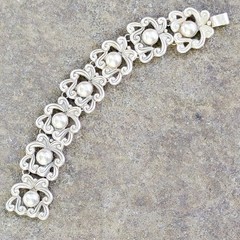 Signed mid-century Taxco sterling panel link bracelet Eagle 3 scrolls orbs