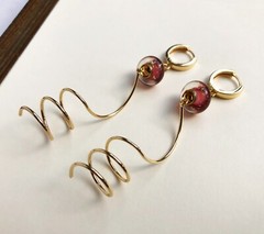 Unmatched earrings dangle, large spiral earrings gold tone