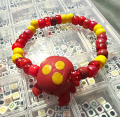 Red & Yellow Plastic Beaded Stretch Bracelet with Animal & Insect Dangle Charm
