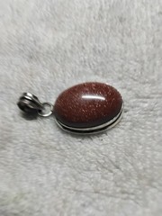 Goldstone Pendant. Bezel Set In Handmade Rhodium Plated Mounting.