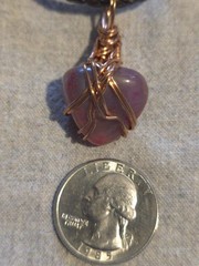 Pink Agate Pendant On A Brown Leather Necklace