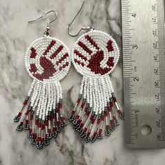 Native American Authentic handmade medallion earrings. Made by prison inmates.