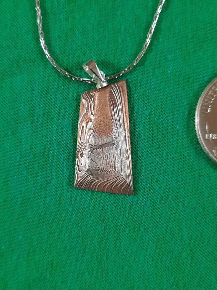 Hand Forged Copper Nickel Mokume Gane pendant on stainless chain