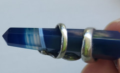 Sterling Silver Pendant of Dolphin pair clutching blue banded Agate crystal