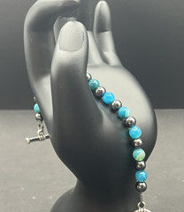 7″ semi-precious striped blue agate and hematite beaded bracelet w/toggle clasp