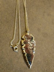 2” Brown & Black Arrowhead accented in gold on 24” gold colored chain