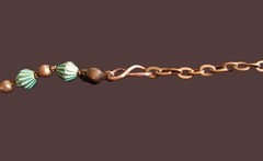 Artisan crafted, 20” green patina bicones, spacers are antique copper, and 3 pen