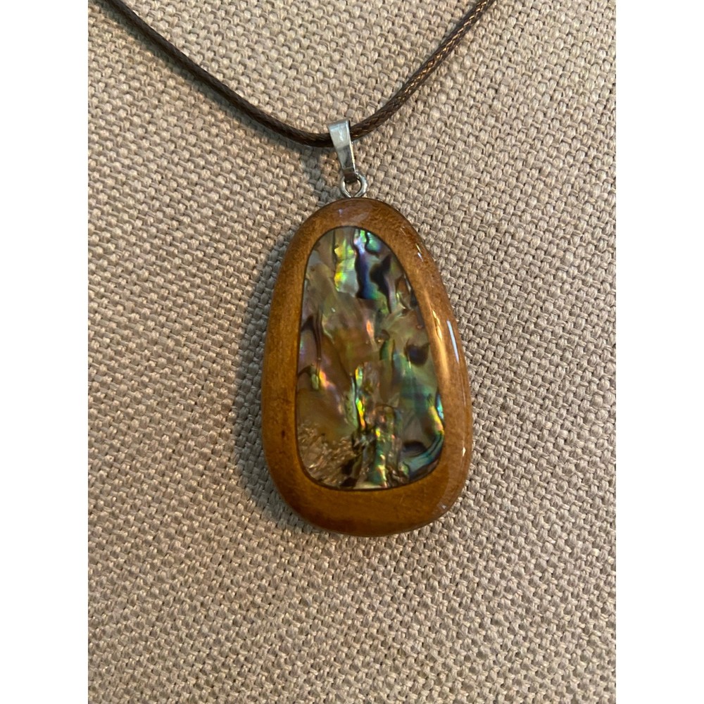 Abalone inlaid in polished wood pendant on cord