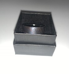 Damascus Steel Wedding Band With Carbon Fiber Inlay.