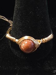 Handmade sizes 4 – 15 Wire-Wrapped Goldstone Rings with Gold-Tone Plated Wire