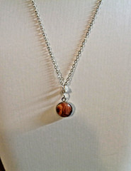 Artisan crafted,beautiful ½» sunstone cab in sterling bezel, on delicate 20” sil