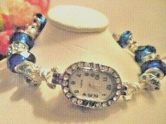 Hand assembled ladies wrist watch bracelet one of a kind with charms&glass beads
