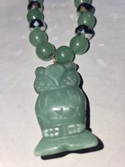 green aventurine beaded necklace features a hand-carved owl pendant accented…