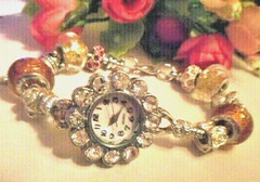 Hand assembled watch/bracelet with glass beads&silver tone charms&a watch