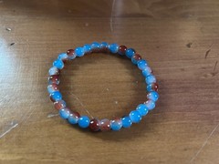Handmade Glass Beaded Bracelet In Blue And Burnt Orange, 6.75″