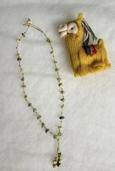 This is a handmade light green serpentine chip stone cord necklace