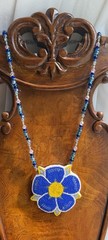 Handmade beaded floral necklace, from Hawaii. Finished leather-style backing.