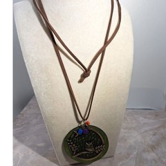 A Wood Disc Necklace With Owl Motif Leather Cord Whimsical Nature Inspired