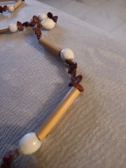 Natural materials necklace with bamboo tubes, seeds, and shell beads
