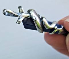Sterling Silver Pendant of Dolphin pair clutching blue banded Agate crystal