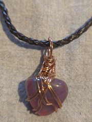 Pink Agate Pendant On A Brown Leather Necklace