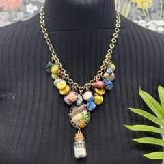 Adorned Crown Jewelry assemblage Pearl seascape bottle of sand shells necklace