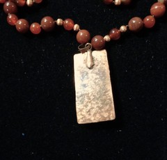 Artisan crafted,1 ¾ x ¾» hammered, antiqued copper pendant with applied Tiger ey