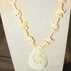 Hand-Carved Elephant Bead Necklace With Ornate Pendant.