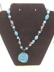 Necklace blue carved soapstone rose w stone, glass plastic & metal beads.