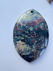 Three natural stone pendants: Plumite and Rhodochrosite
