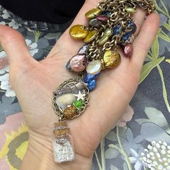 Adorned Crown Jewelry assemblage Pearl seascape bottle of sand shells necklace