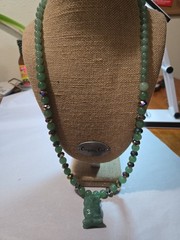 green aventurine beaded necklace features a hand-carved owl pendant accented…