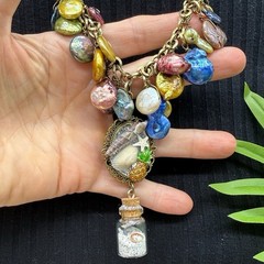 Adorned Crown Jewelry assemblage Pearl seascape bottle of sand shells necklace