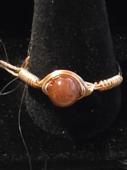 Handmade sizes 4 – 15 Wire-Wrapped Goldstone Rings with Gold-Tone Plated Wire