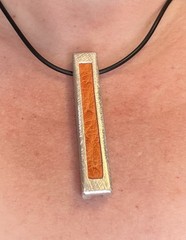 African Artisan 3” Aluminum Pendant W/ Orange Leather Inlay, 18” Silicone Cord