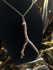One of a kind jewelry made from real pieces of wood coated in resin