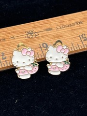 Clip on earrings with Hello Kitty holding a pink strawberry costume jewelry