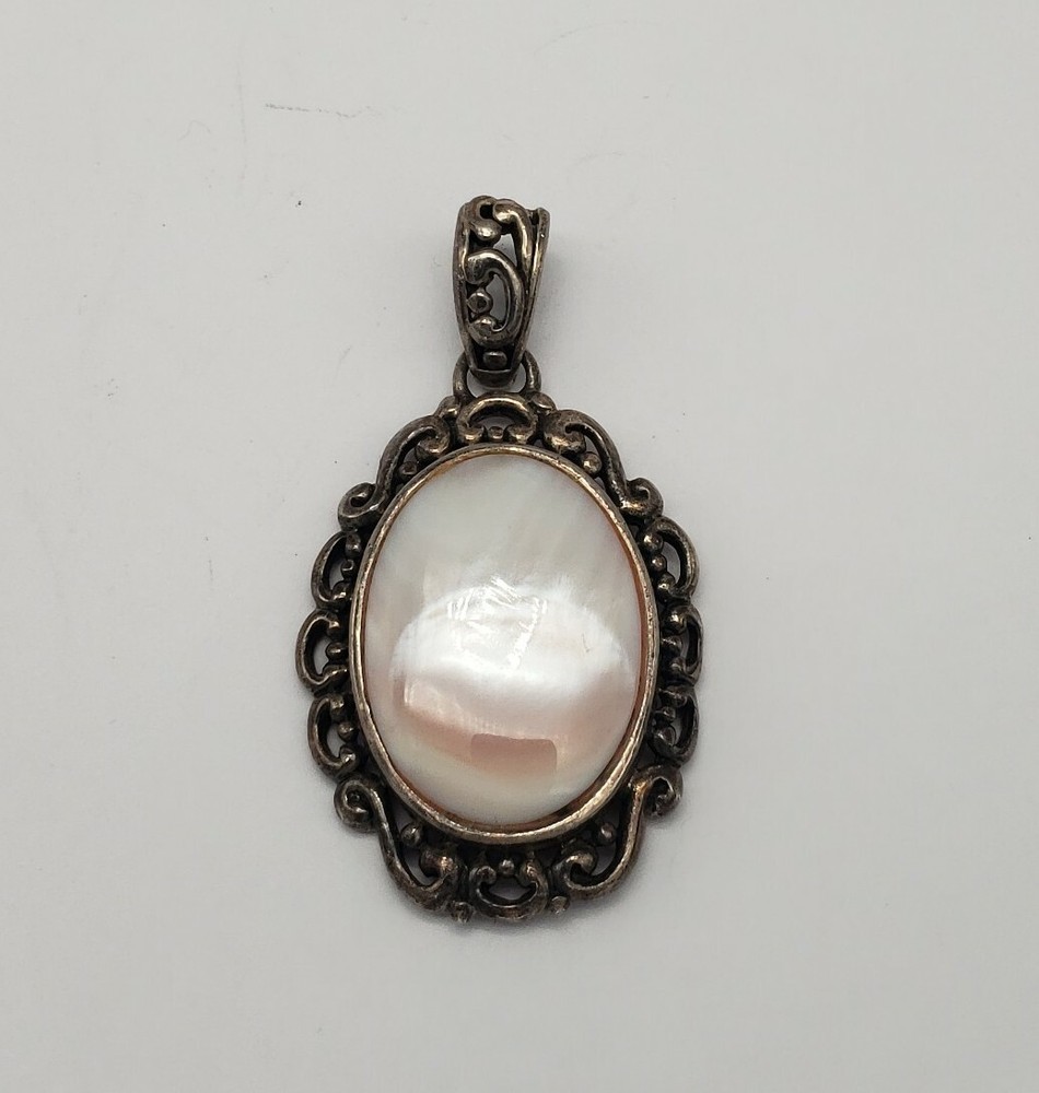 DESIGNER STERLING SILVER AND OYSTER SHELL PENDANT