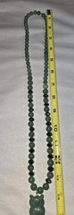 green aventurine beaded necklace features a hand-carved owl pendant accented…