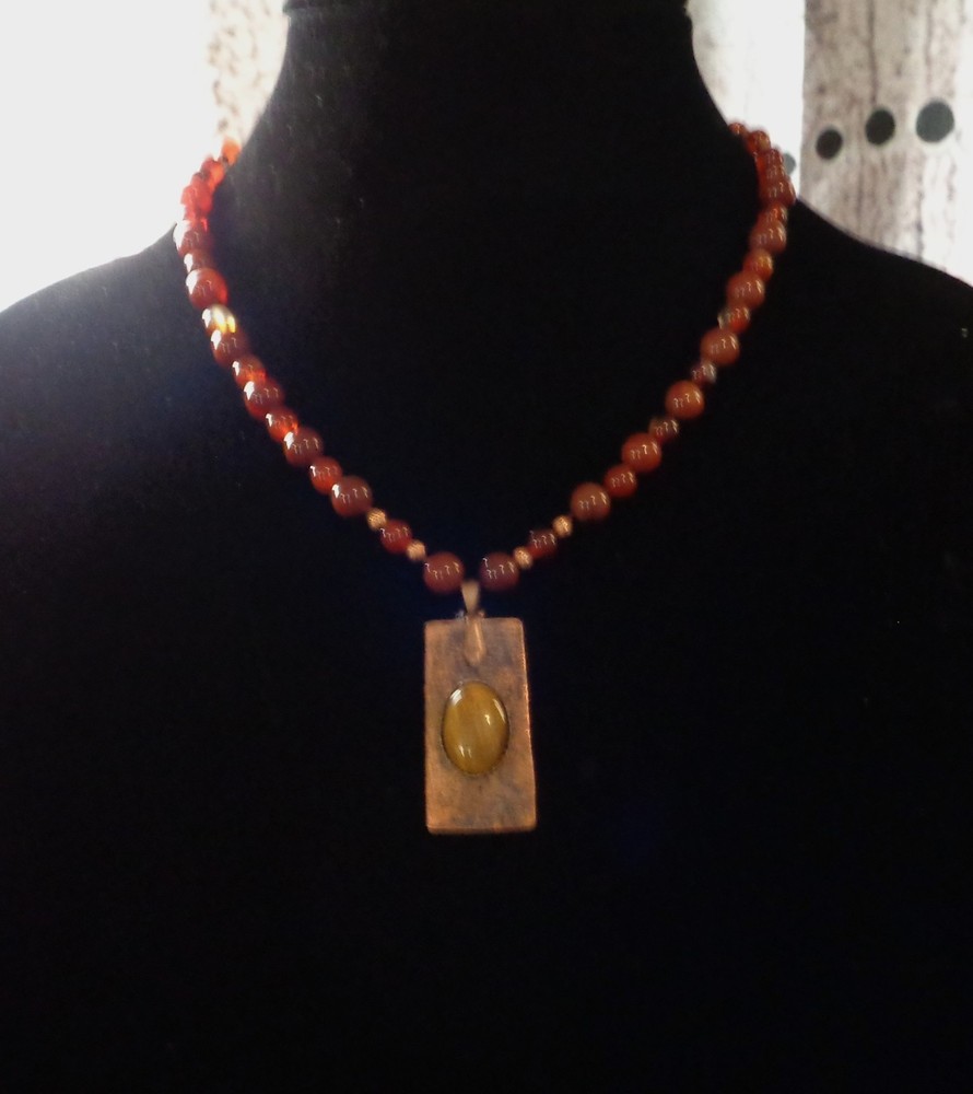 Artisan crafted,1 ¾ x ¾» hammered, antiqued copper pendant with applied Tiger ey
