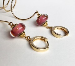 Unmatched earrings dangle, large spiral earrings gold tone