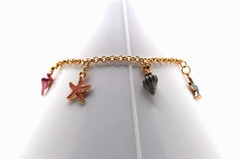 Handcrafted 8.5″ gold chain with green, pink, and blue sea life charms bracelet