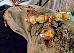 Artisan crafted, 15mm resin and dried flower pendant on strand of vintage yellow