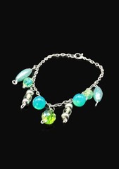 Uranium glass assorted bead charm? bracelet style on silver rolo chain 7″