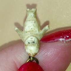 Strange Hand Carved Baby Necklace Tiny antique doll Kewpie charm vintage