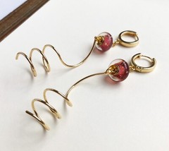 Unmatched earrings dangle, large spiral earrings gold tone